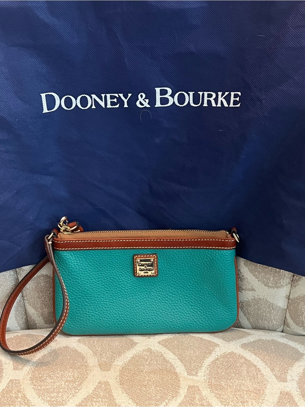 Dooney & Bourke Teal Pebble Leather Wristlet with Brown Trim